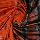 Ultra close-up of Bomkai Silk Saree fabric, revealing intricate handloom texture and butta weave details.