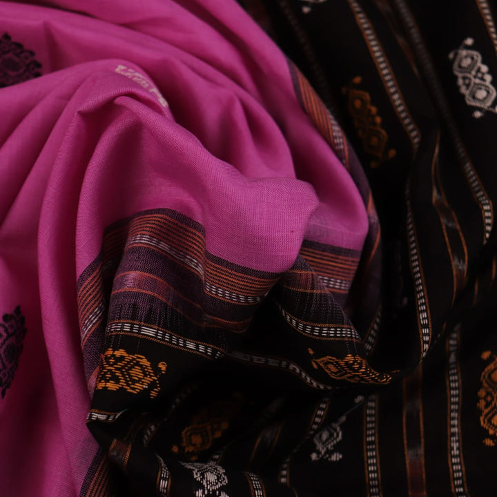 Full view of a pink and black Bomkai cotton saree with a butta pattern and intricate border.