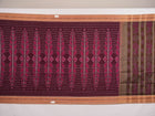 Model wearing an elegantly draped maroon and brown Sambalpuri cotton saree with traditional ikat motifs.