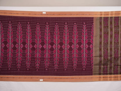 Model wearing an elegantly draped maroon and brown Sambalpuri cotton saree with traditional ikat motifs.