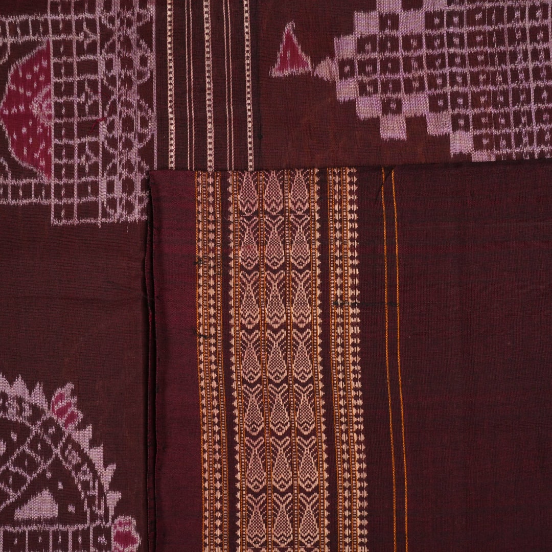 Full layout of the brown and maroon Sambalpuri cotton saree showing the complete body pattern and border.