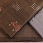 Detail of grey Bomkai silk blouse piece with butta pattern for dress material.