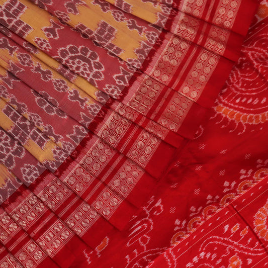 Close-up of multicolored silk Sambalpuri saree fabric showing intricate handloom weave texture.