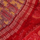 Close-up of multicolored silk Sambalpuri saree fabric showing intricate handloom weave texture.