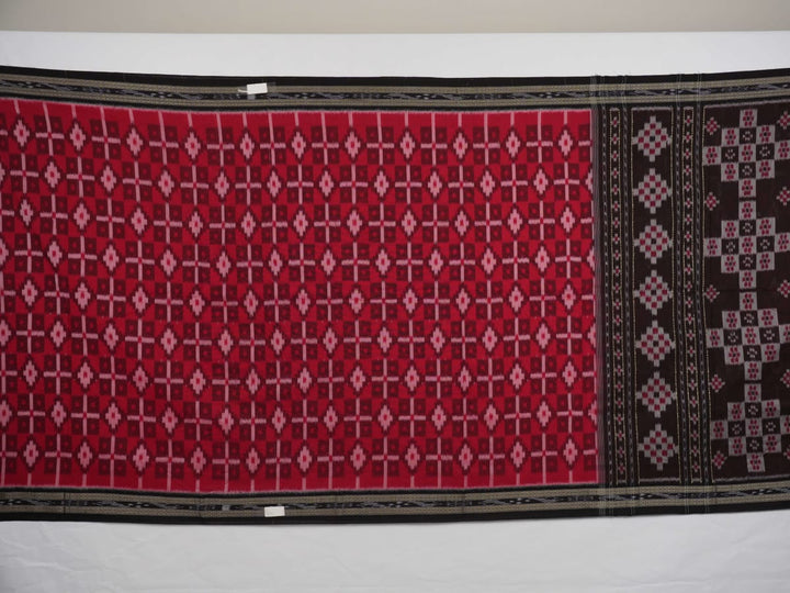 Model showcasing an elegant drape of a red and black Sambalpuri cotton handloom saree with traditional motifs