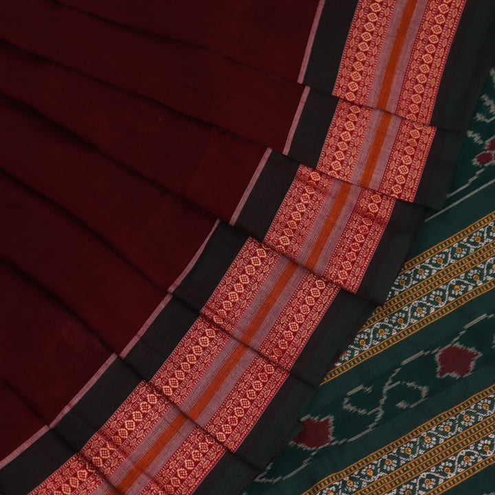 Full view of a maroon and green cotton Bomkai saree with a butta pattern.