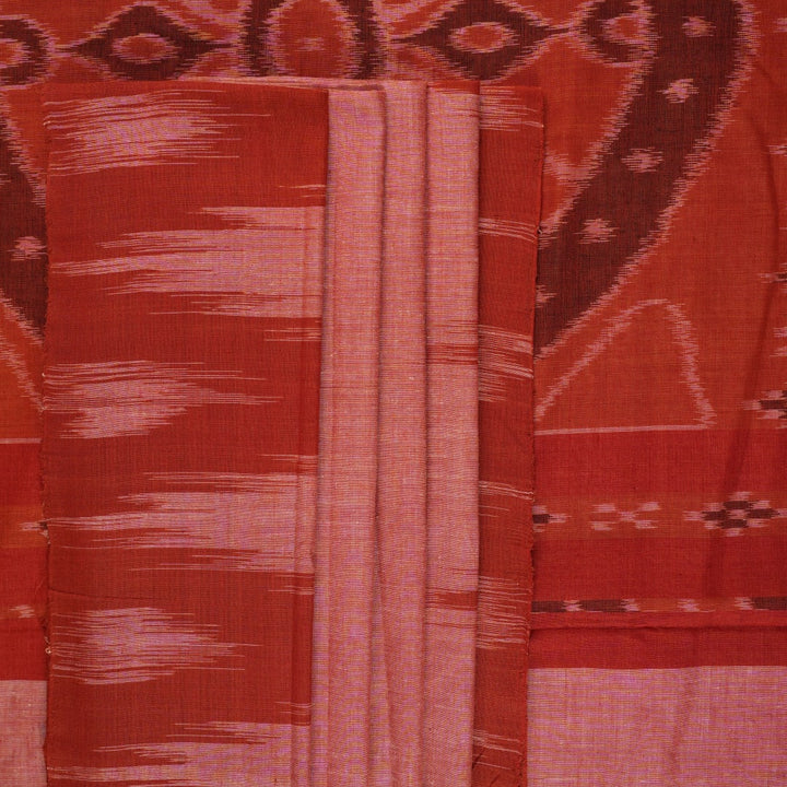 Professional styling view of a rust Sambalpuri cotton saree draped on a model for an elegant ethnic look.