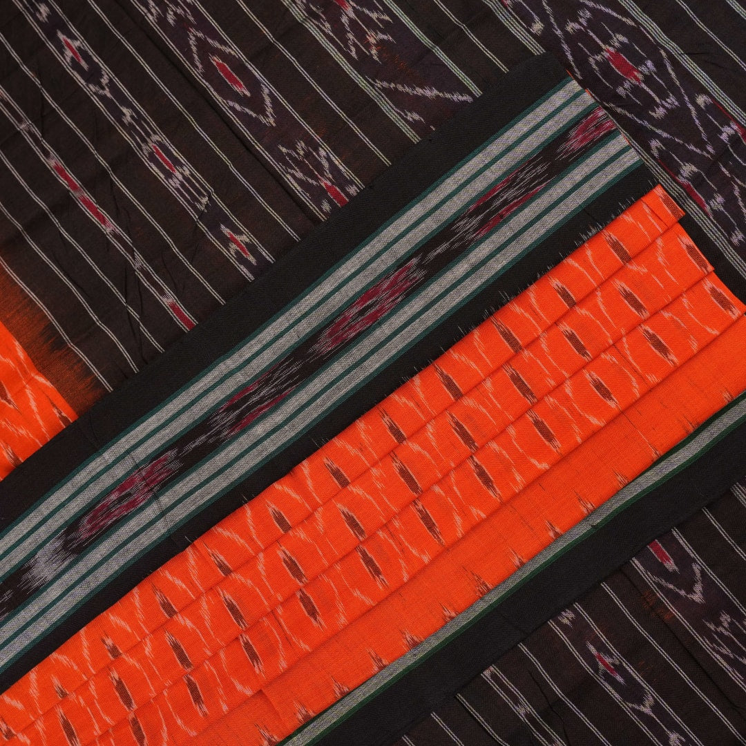Model wearing an orange and black Sambalpuri cotton saree, styled in an elegant traditional drape.
