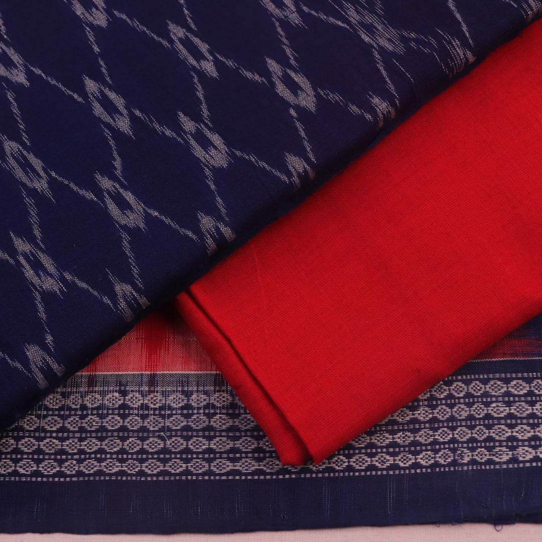 Detail of blue and red Sambalpuri cotton dress material blouse piece with motifs.