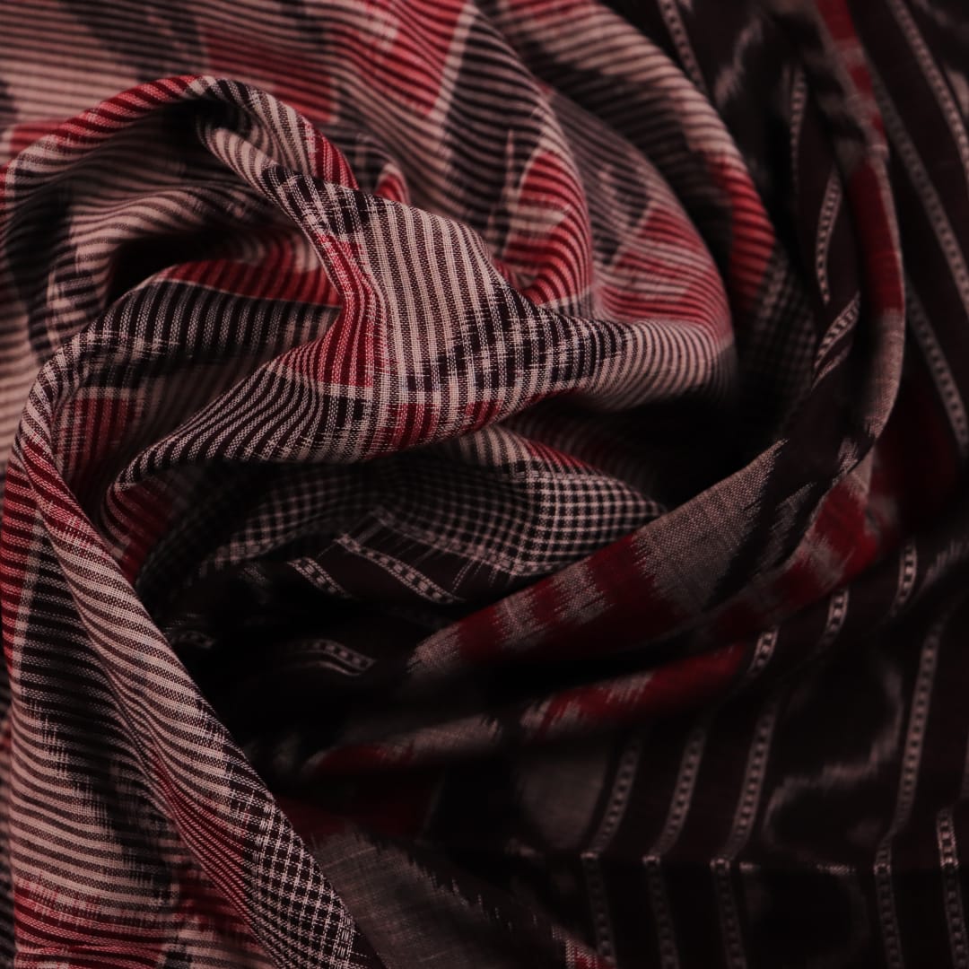 Grey and black cotton Sambalpuri saree with intricate motif pattern, displayed in full view.