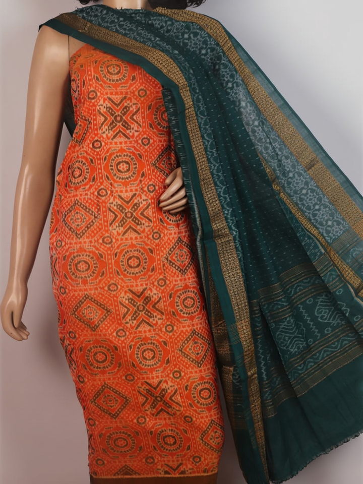 Blouse piece detail of an orange and green motif Sambalpuri cotton dress material.