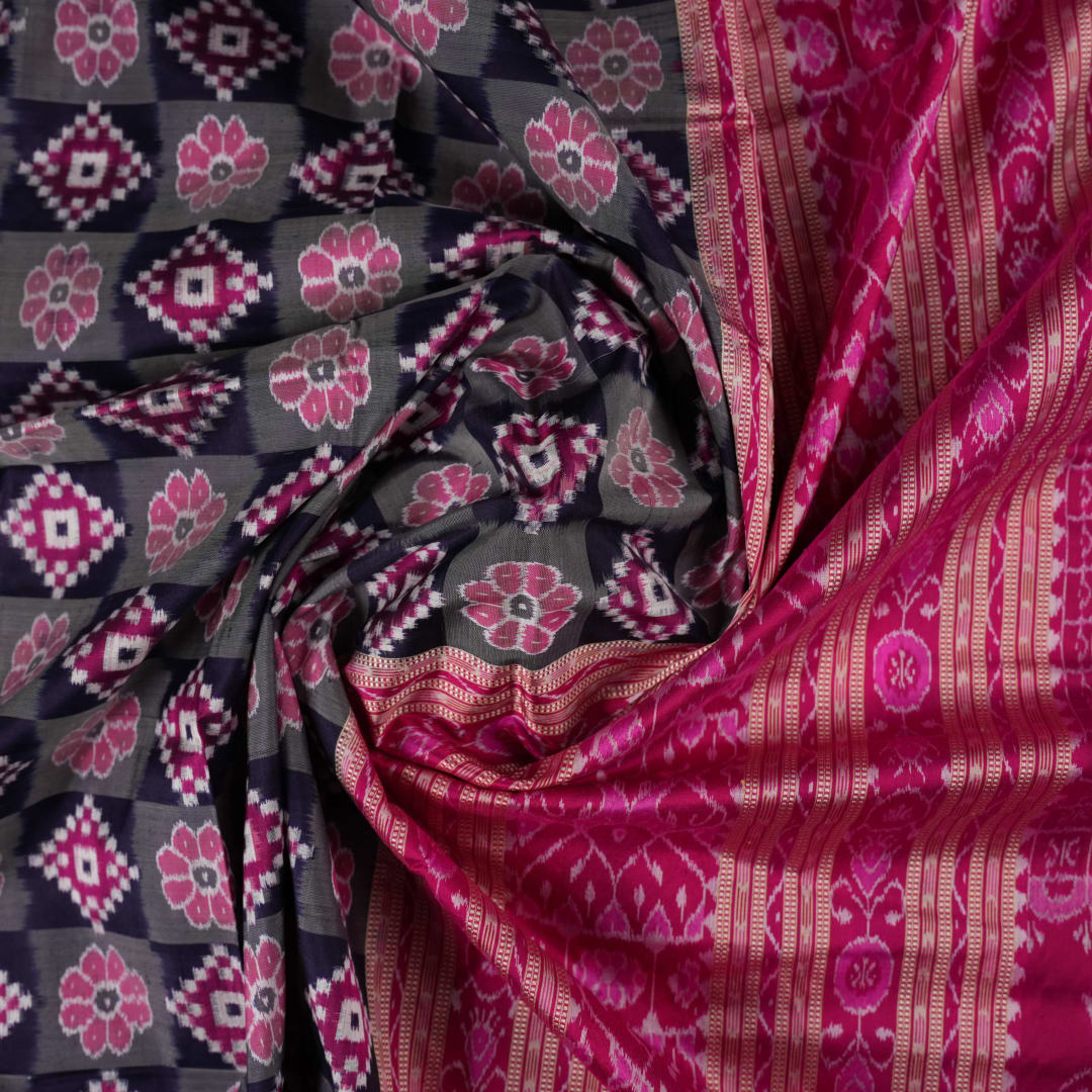 Detail of the luxurious silk texture and exquisite handloom weave of the Multi-color Pink Sambalpuri Saree.