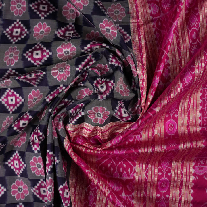 Detail of the luxurious silk texture and exquisite handloom weave of the Multi-color Pink Sambalpuri Saree.