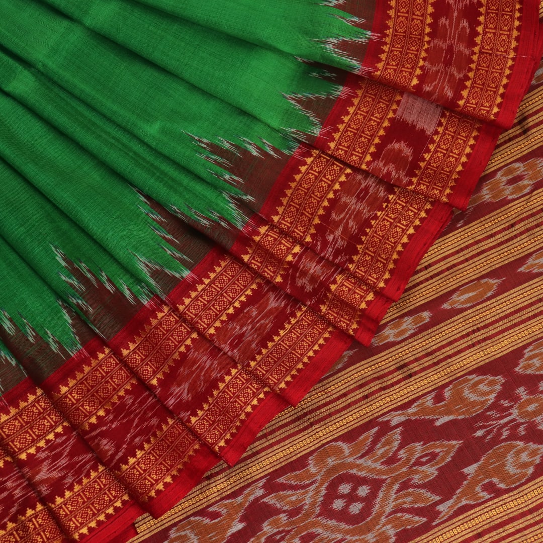 Green Khandua silk saree, styled or draped to show its overall look and fall.