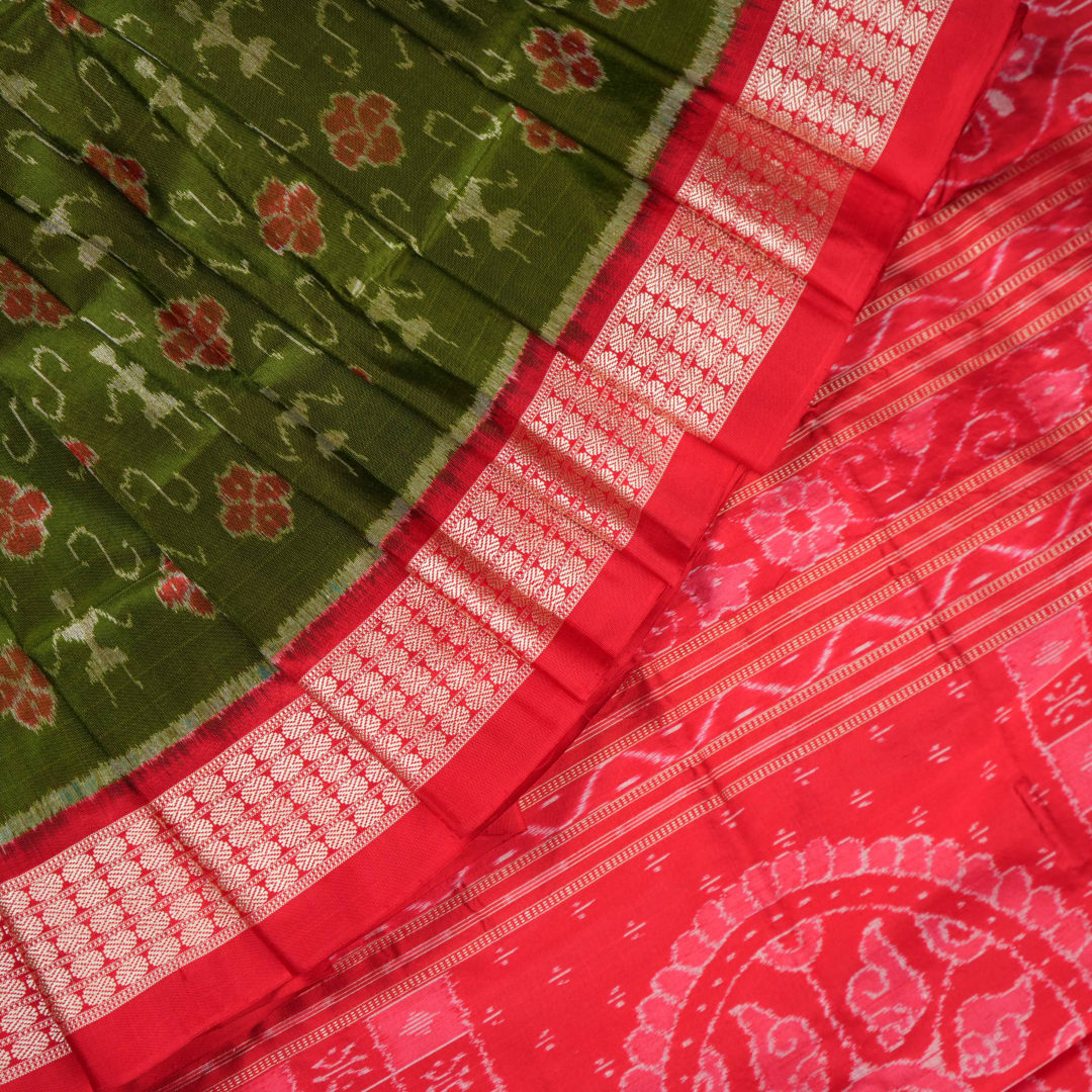 Close-up showing the rich, smooth texture of the green Sambalpuri Silk Saree's weave, highlighting its quality.