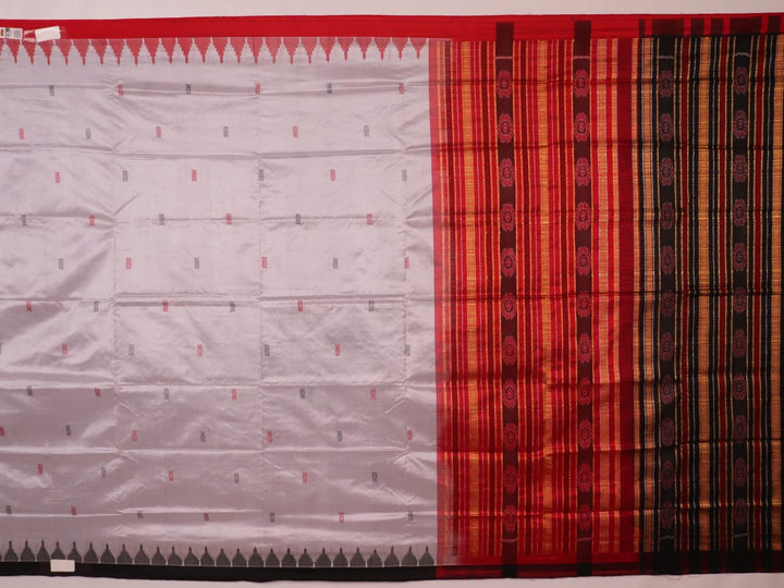 Close-up of grey and red Sambalpuri Silk saree fabric texture, highlighting butta pattern weave.