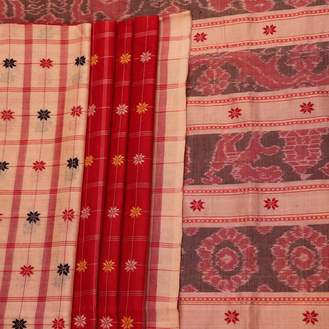 Full body view of a vibrant red cotton Sambalpuri saree featuring intricate butta patterns and a cream border.