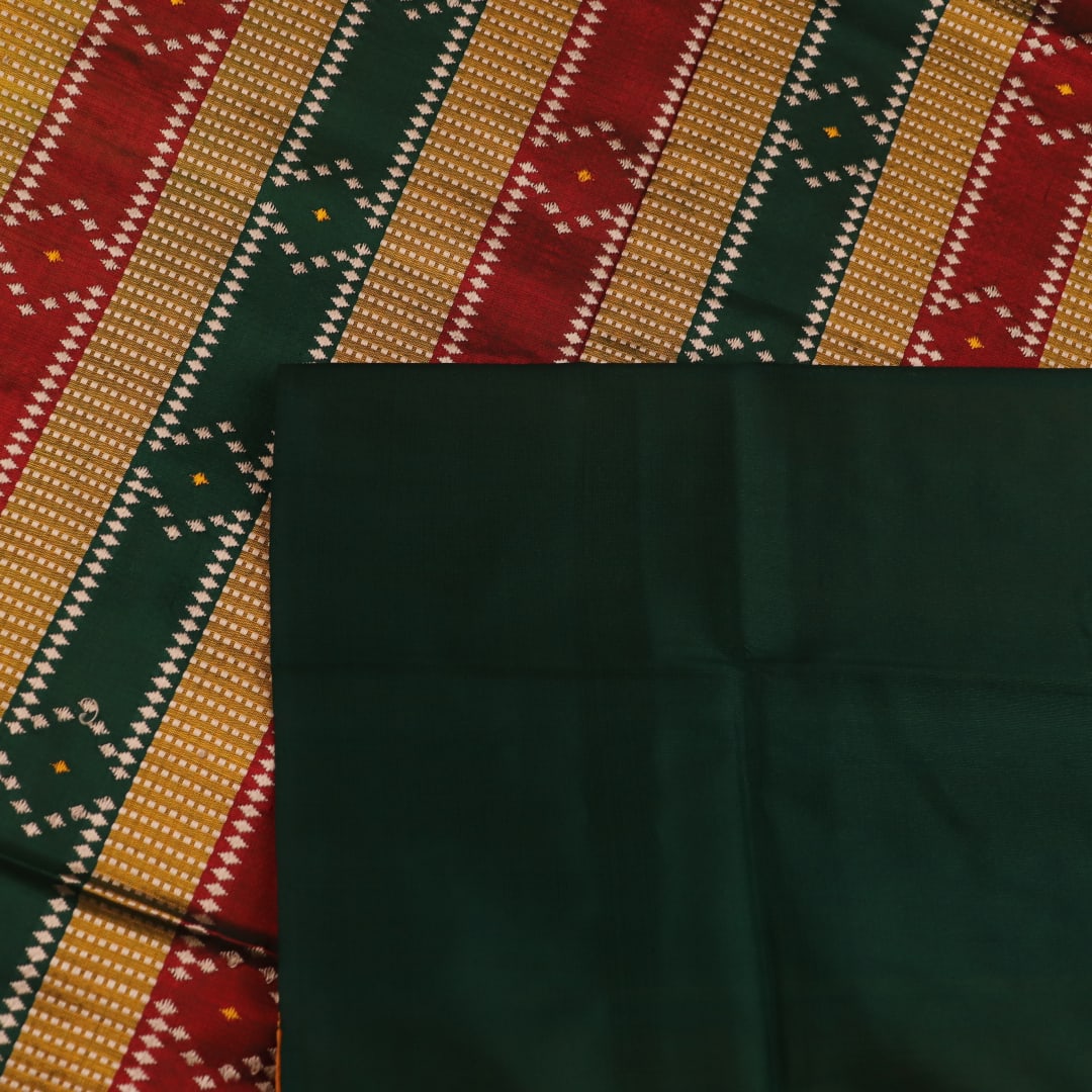Close-up of yellow & green Sambalpuri Silk Saree fabric texture, showing Butta pattern.