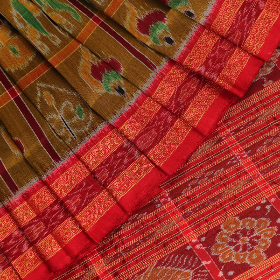 Green Khandua silk saree styled and draped to showcase the Nabakothi pattern, a traditional handloom saree.