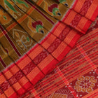 Green Khandua silk saree styled and draped to showcase the Nabakothi pattern, a traditional handloom saree.