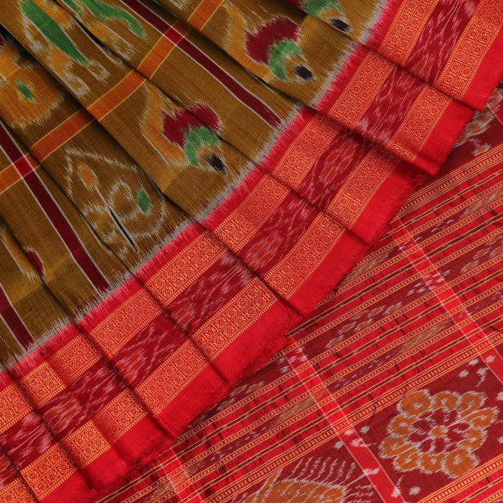 Green Khandua silk saree styled and draped to showcase the Nabakothi pattern, a traditional handloom saree.