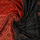 Full layout of the orange and black Sambalpuri cotton saree displaying the complete pattern and design.