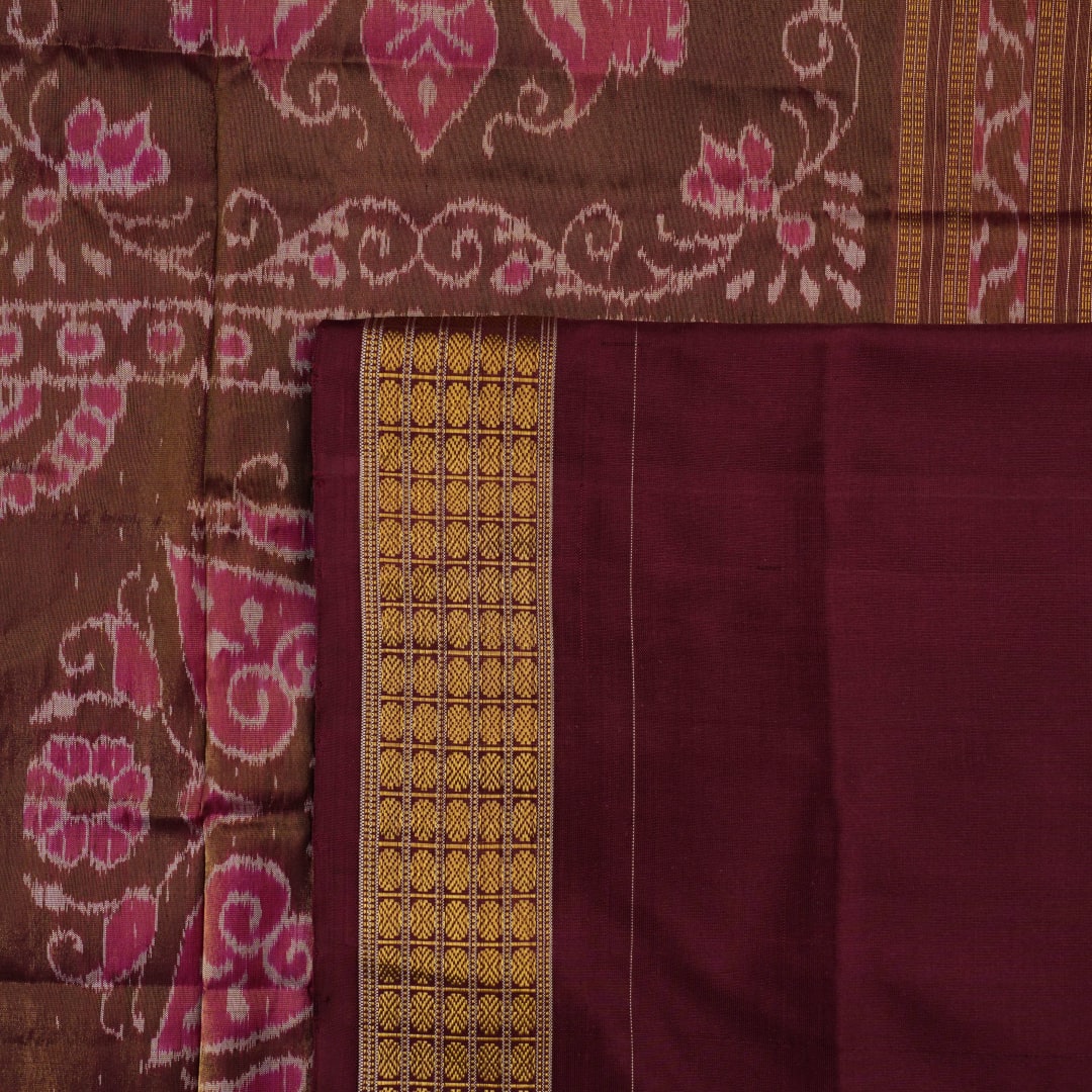 Close-up of luxurious silk fabric texture and intricate weave details of the multi-color Sambalpuri saree.