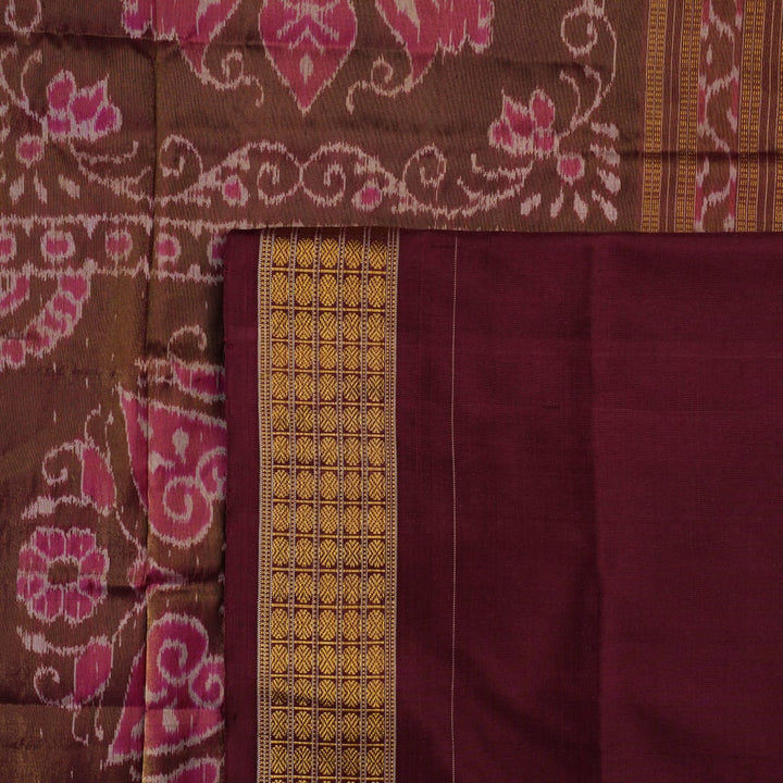Close-up of luxurious silk fabric texture and intricate weave details of the multi-color Sambalpuri saree.