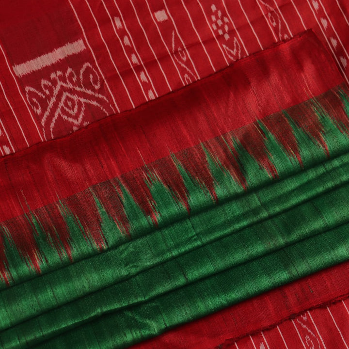 Close-up of green and red tussar silk saree fabric texture