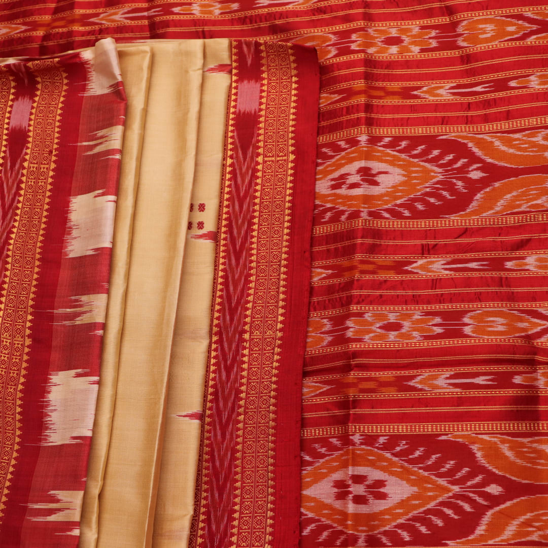 Saree styling: Cream Khandua silk saree with maroon butta pattern draped elegantly.
