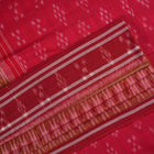 Model styled in a red multi-color Sambalpuri cotton saree featuring traditional hand-woven ikat motifs.