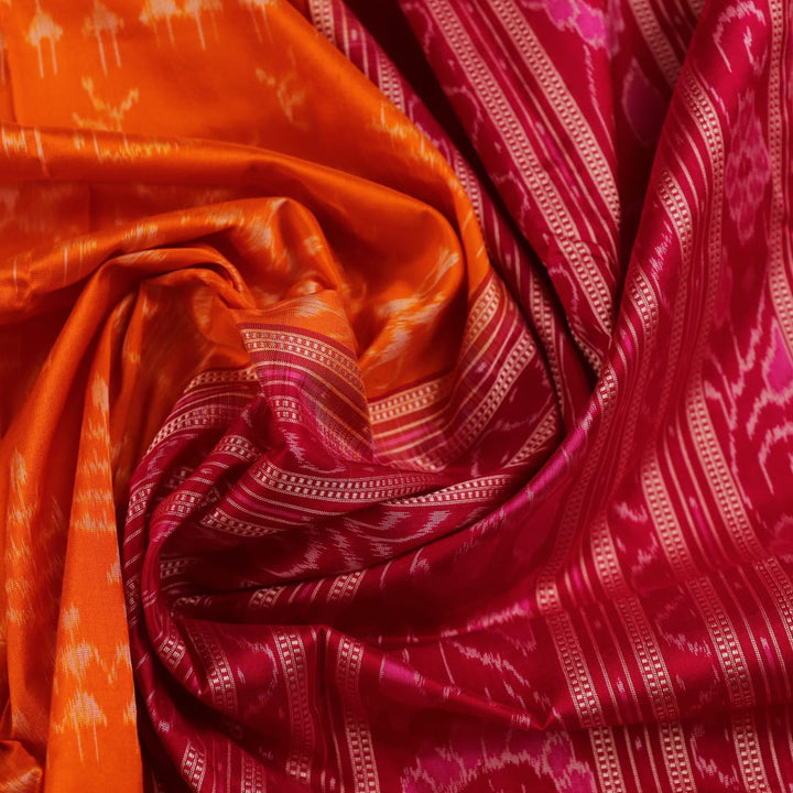 Close-up of intricate sambalpuri silk saree's yellow fabric featuring detailed motifs in rani color