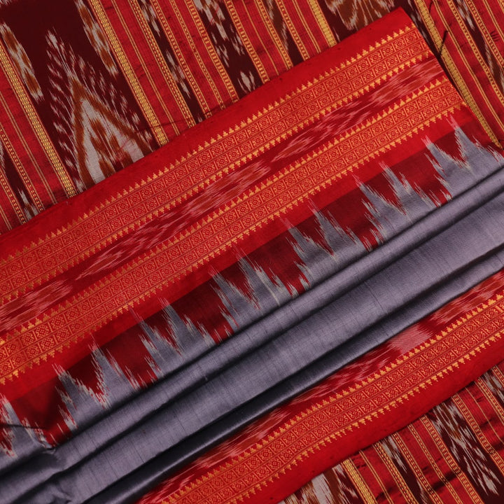 Grey Khandua silk saree styled and draped, showcasing the plain body and red border.