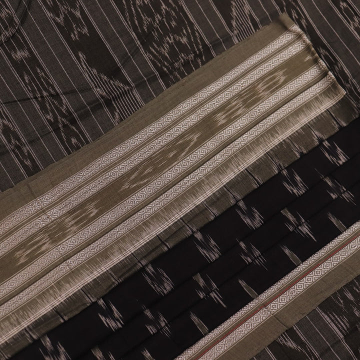 Saree styled; black Sambalpuri cotton saree with grey motifs showcased in a draped presentation.