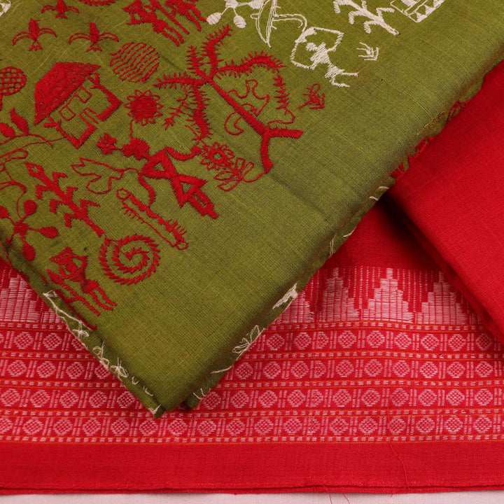 Close-up of a green cotton Sambalpuri dress material with a red doll pattern blouse piece.