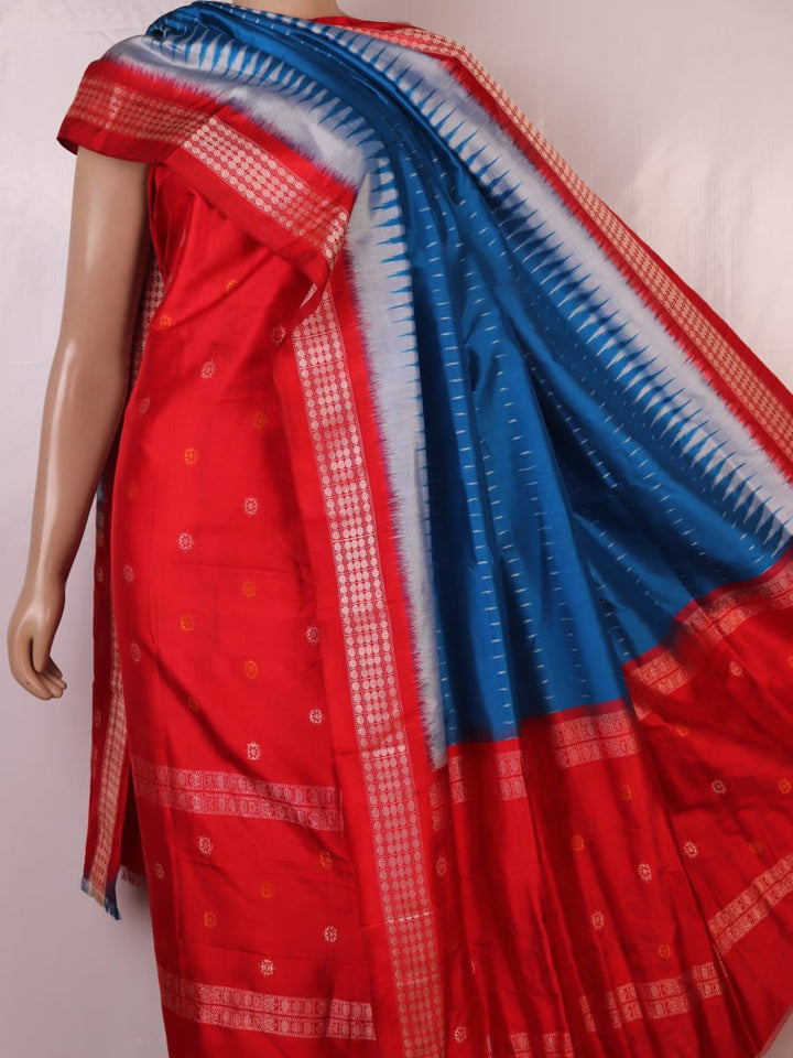 Red and blue Bomkai silk blouse piece with butta pattern.